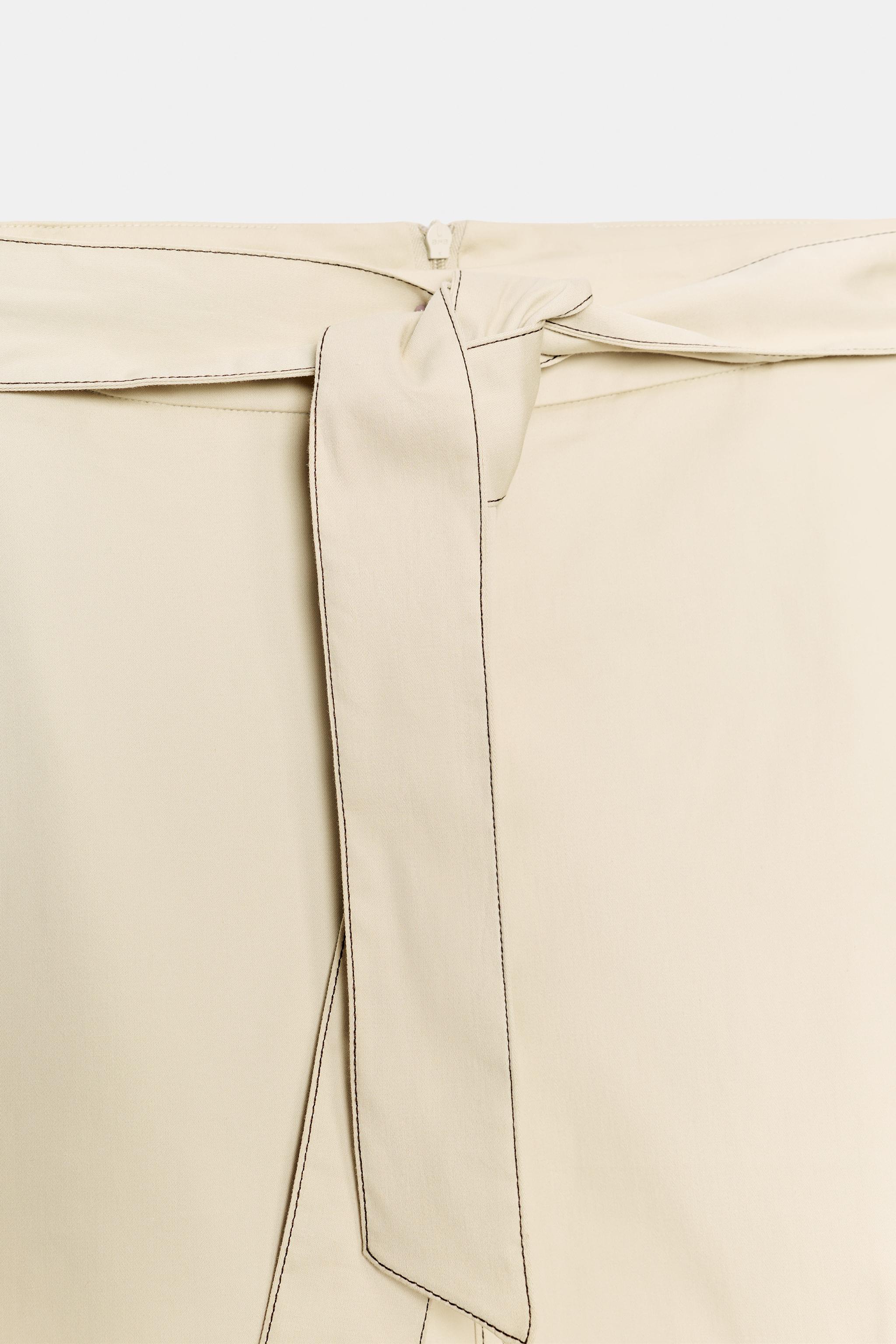 CONTRAST STITCH BELTED SKIRT